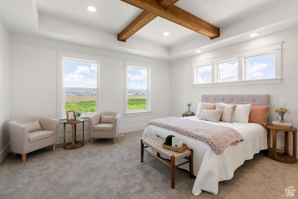 Carpeted bedroom with beamed ceiling, recessed lighting, multiple windows, and baseboards