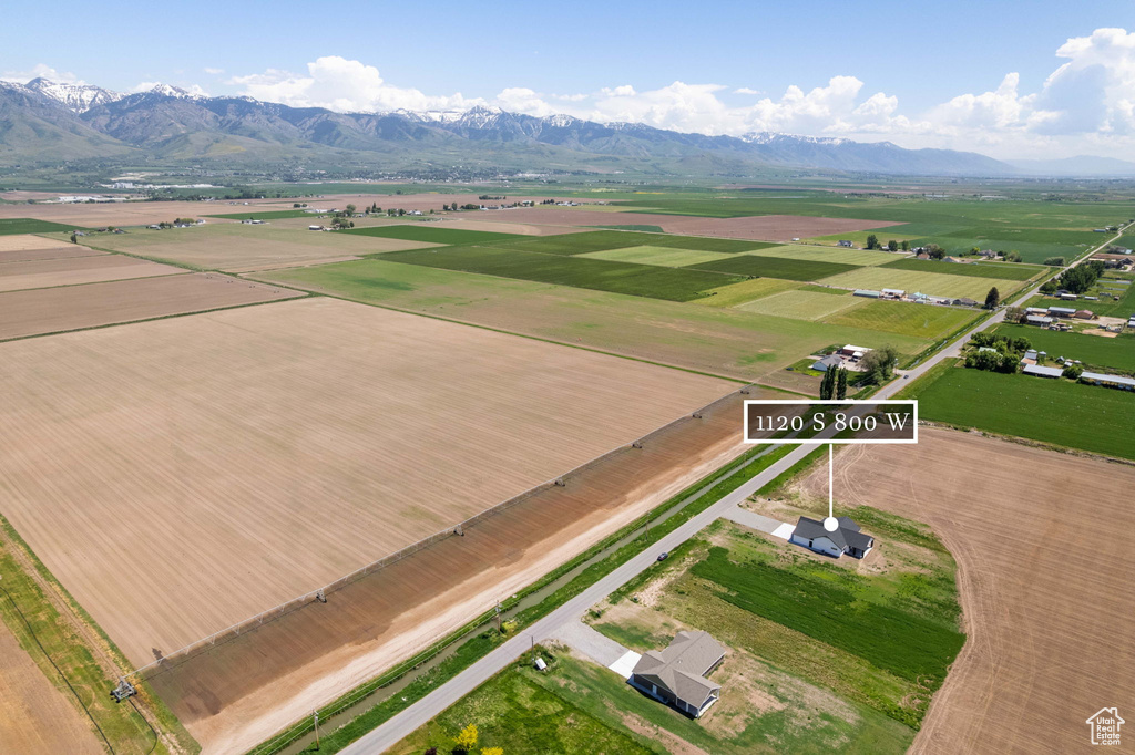 Aerial view of sparsely populated area featuring a mountainous background