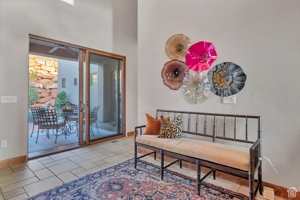 Interior space with a towering ceiling and baseboards