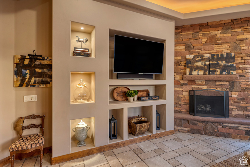 Living area with a stone fireplace