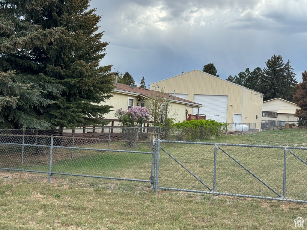 View of side of home with a gate