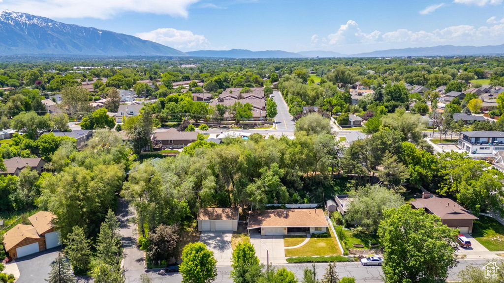 Aerial perspective of suburban area featuring a mountainous background