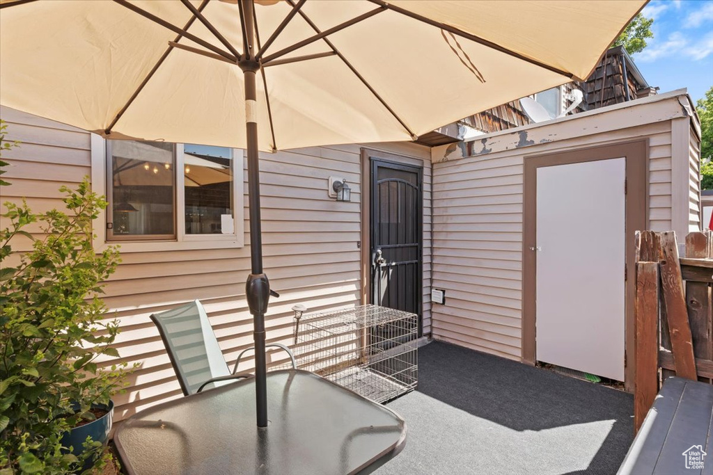 View of patio with outdoor dining area