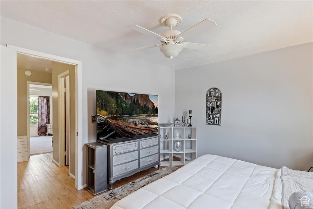 Bedroom featuring wood finished floors and ceiling fan