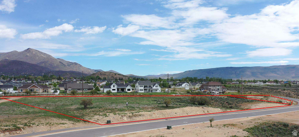 View of mountain backdrop with nearby suburban area