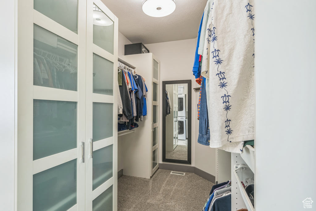 Walk in closet featuring carpet flooring