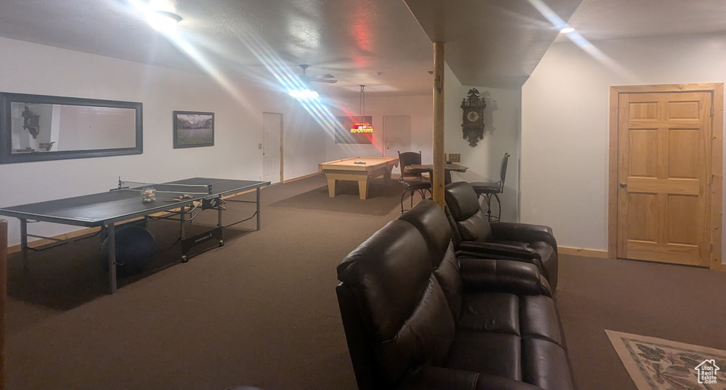 Living room featuring carpet floors and billiards
