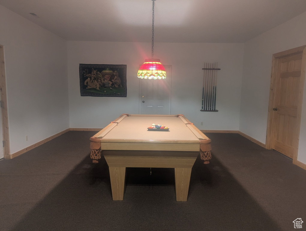 Game room featuring dark colored carpet and billiards