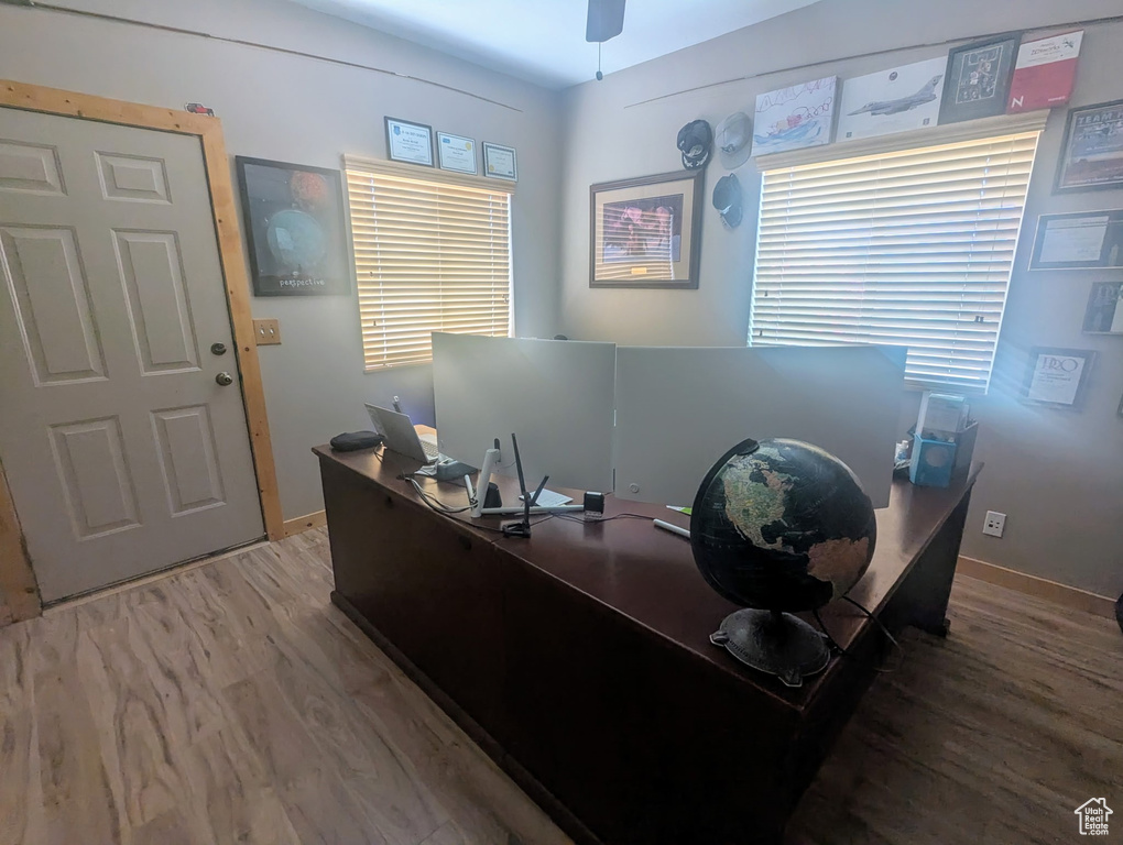 Office featuring wood finished floors and ceiling fan