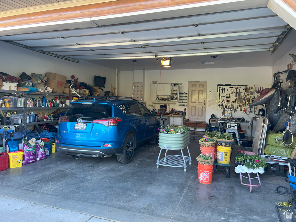Garage featuring a garage door opener
