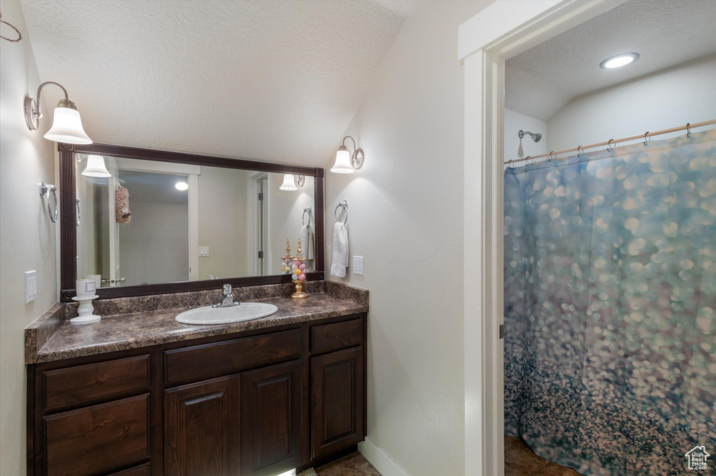 Bathroom with vanity and a shower with curtain