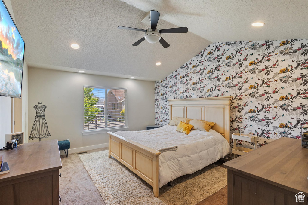 Bedroom featuring light carpet, baseboards, wallpapered walls, recessed lighting, and a textured ceiling