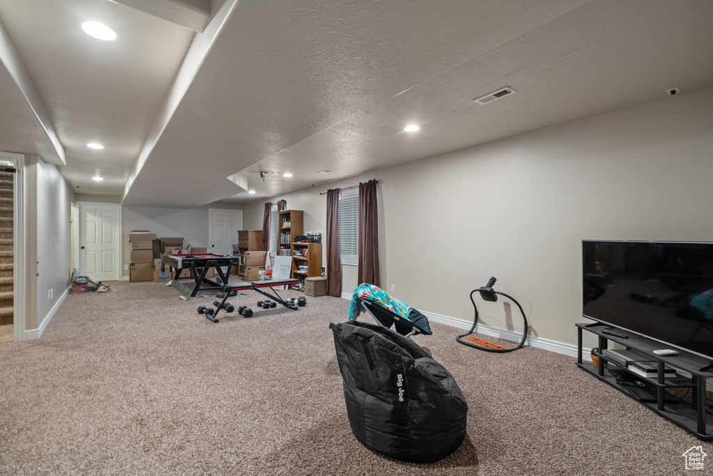 Playroom with carpet floors, baseboards, and recessed lighting