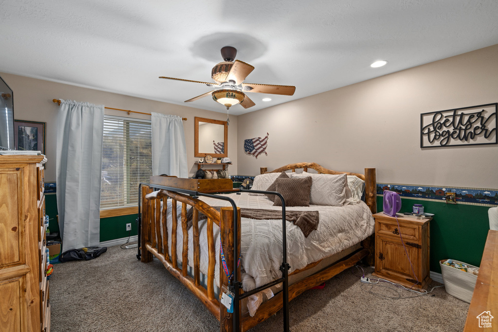 Carpeted bedroom with baseboards, recessed lighting, and a ceiling fan