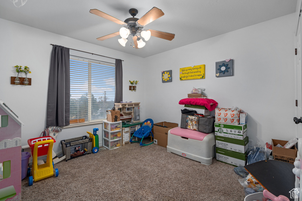 Rec room with carpet flooring and a ceiling fan