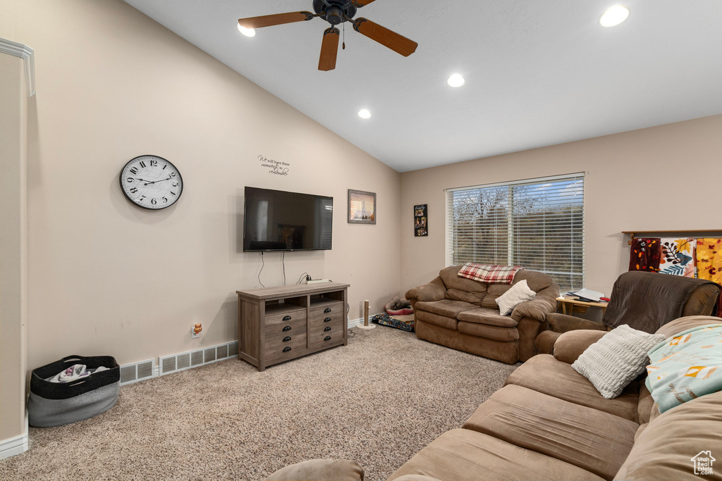 Living room with recessed lighting, a ceiling fan, carpet flooring, baseboards, and lofted ceiling
