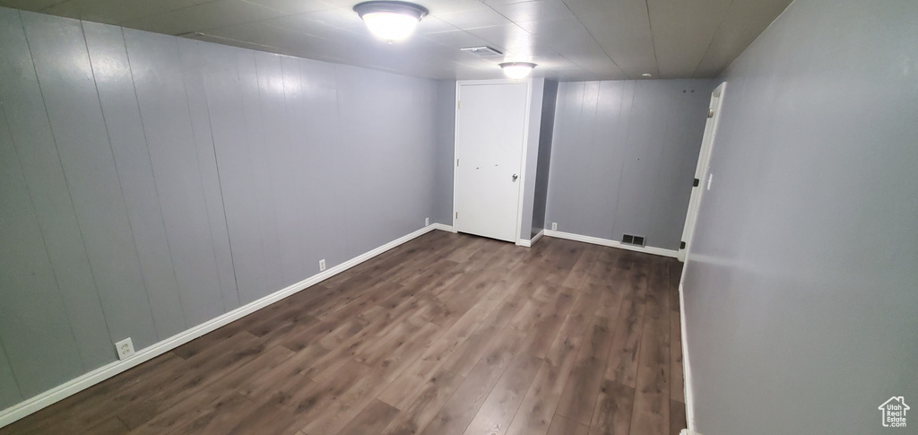 Finished below grade area with wood finished floors and baseboards