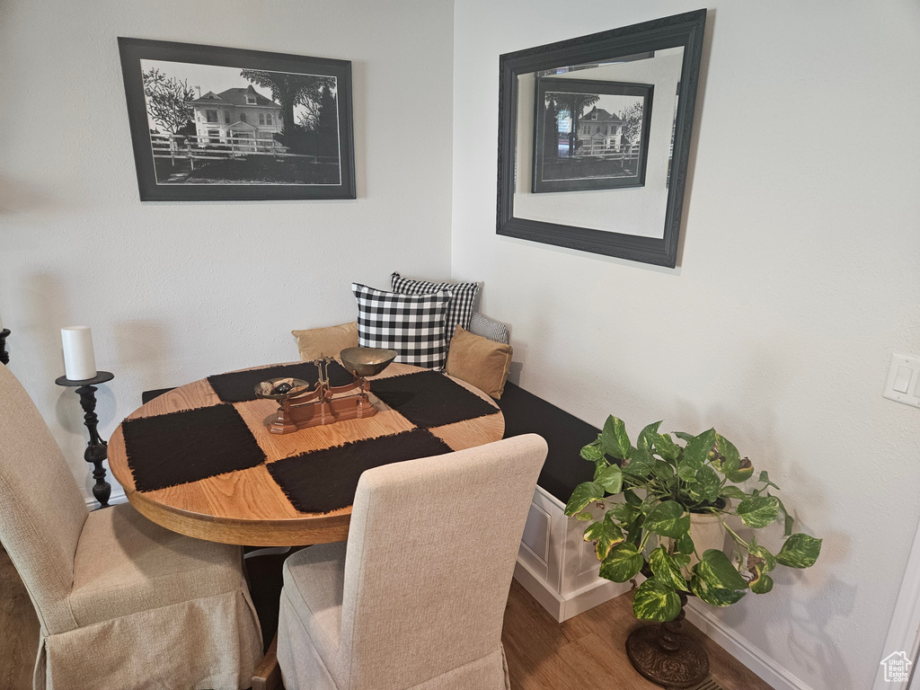 Dining area with wood finished floors and baseboards