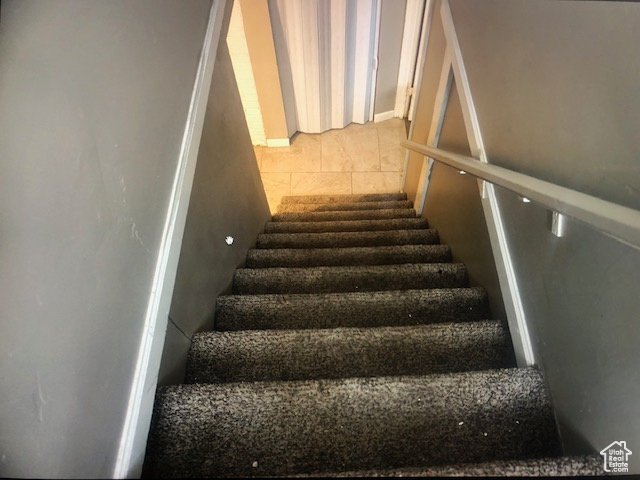 Stairway featuring tile patterned flooring
