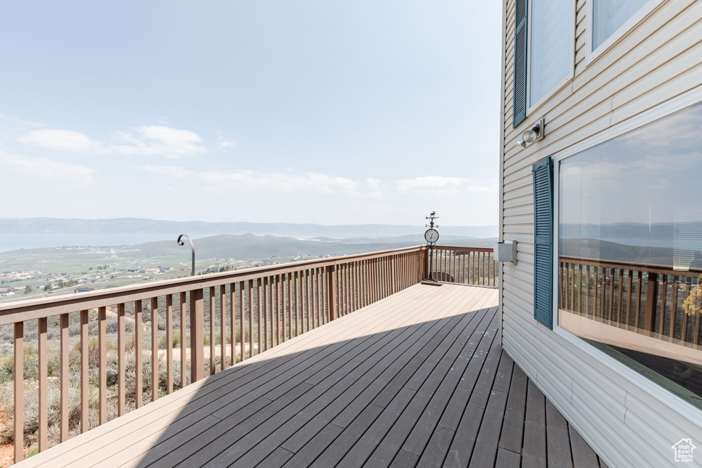 Wooden terrace featuring a mountain view