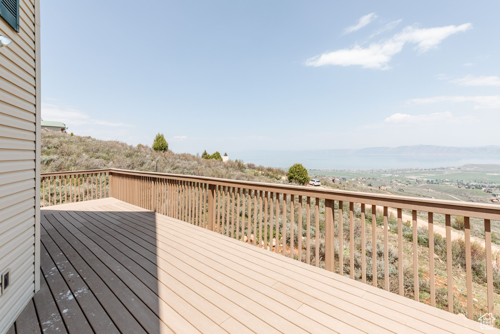 Wooden terrace featuring a mountain view