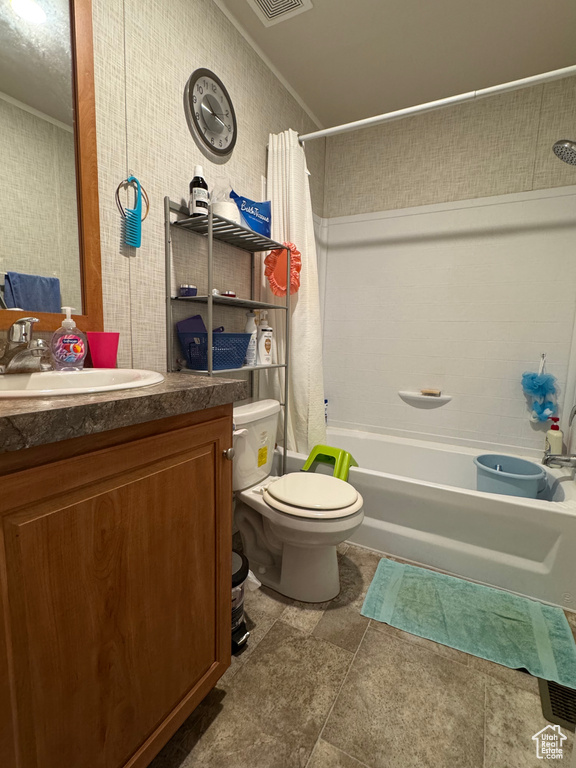 Bathroom with shower / bathtub combination with curtain, toilet, vanity, and crown molding