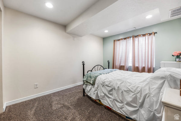 Bedroom featuring carpet, recessed lighting, and baseboards