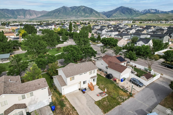 Aerial perspective of suburban area with a mountainous background