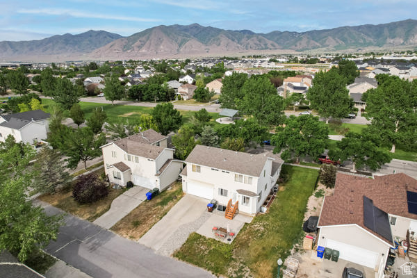 Aerial view of residential area featuring mountains