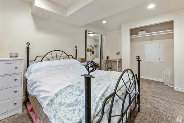 Carpeted bedroom featuring baseboards and recessed lighting
