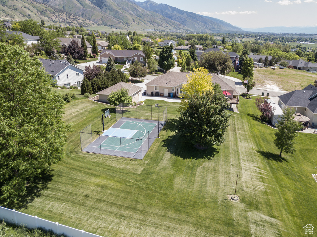 Aerial perspective of suburban area with a mountainous background