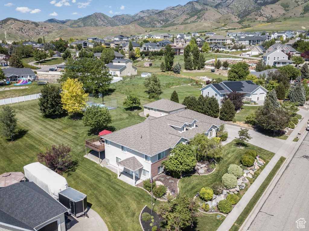 Aerial perspective of suburban area featuring a mountain backdrop