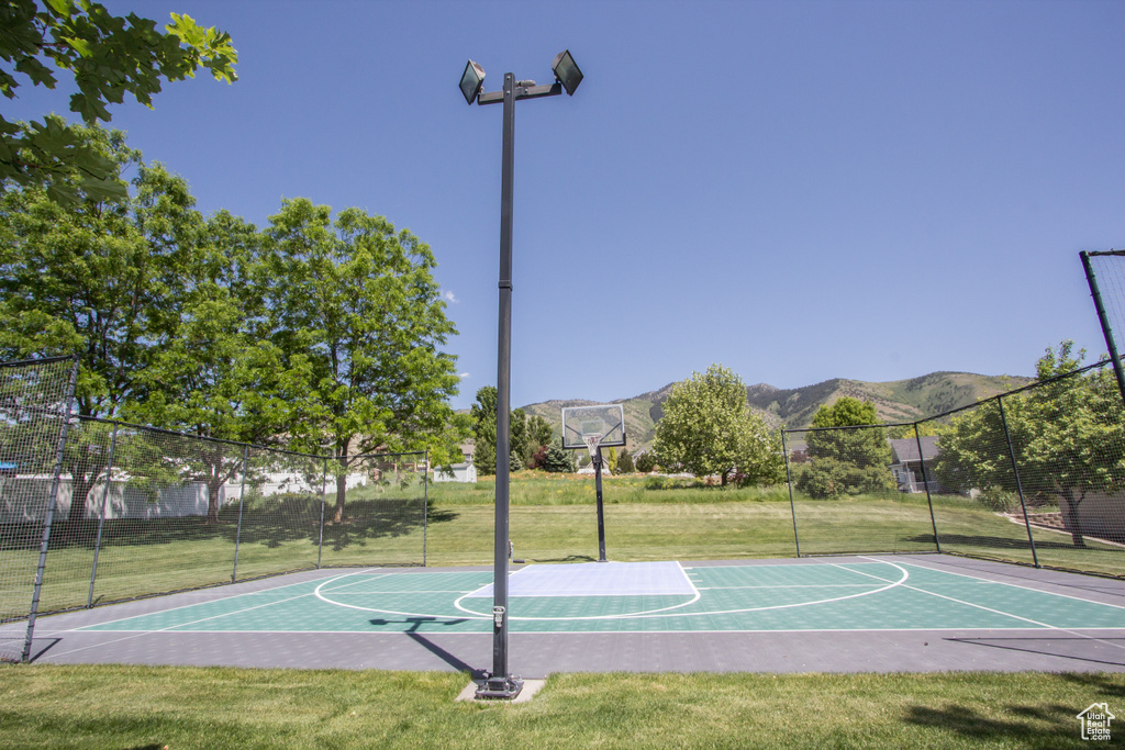 View of sport court with community basketball court and a mountain view