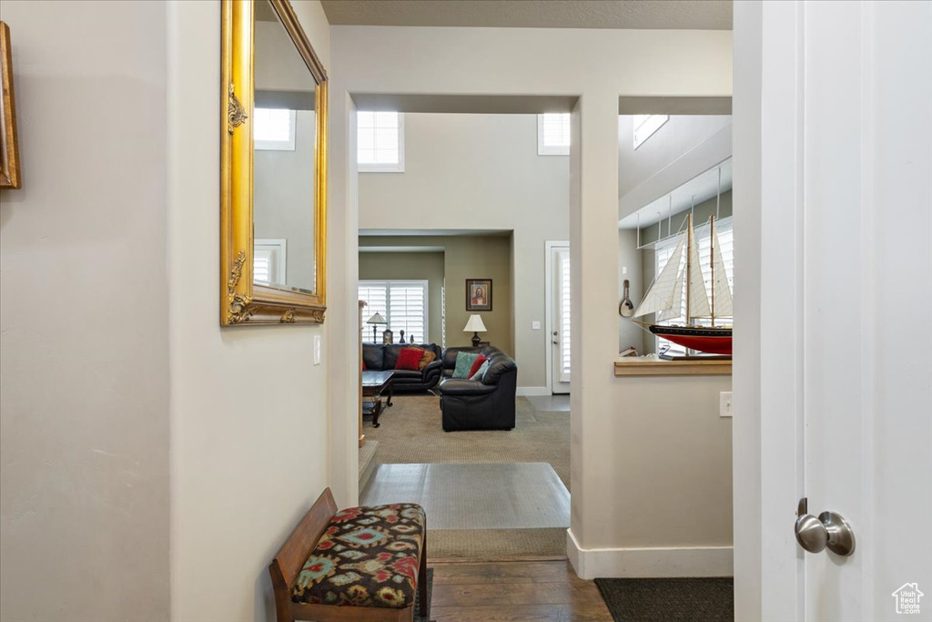 Hall featuring baseboards and wood finished floors