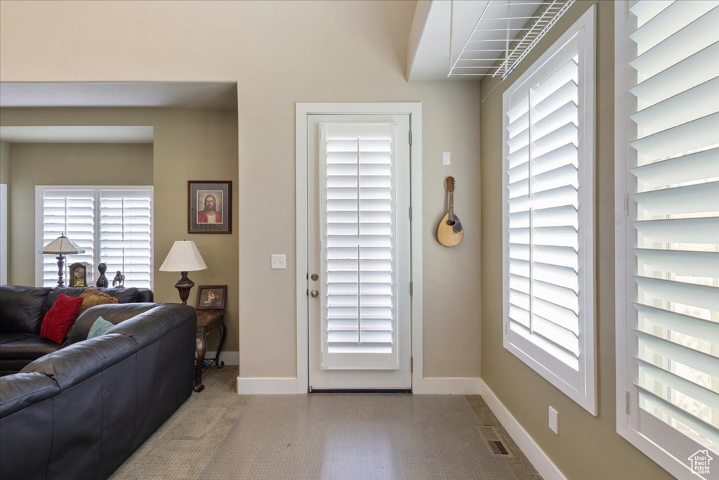 Entryway featuring baseboards and healthy amount of natural light