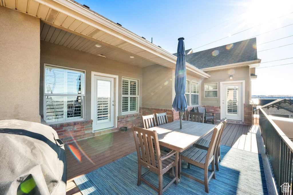 Wooden terrace featuring outdoor dining space