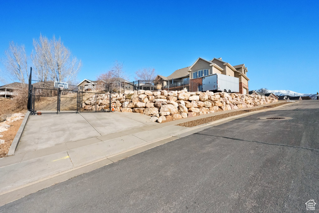 View of street with a gate and curbs