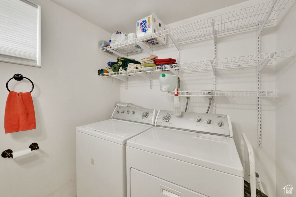 Washroom featuring washing machine and dryer