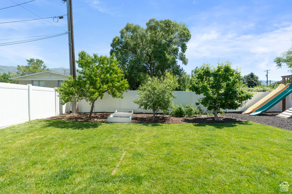 View of yard featuring a playground