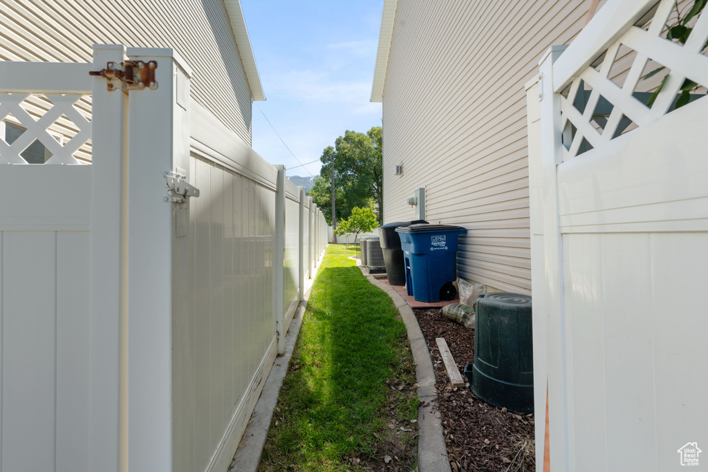View of side of home featuring central AC unit