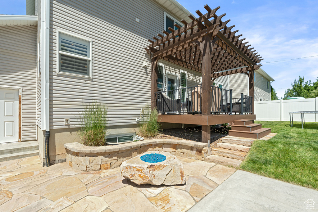 View of patio / terrace with a wooden deck and a pergola