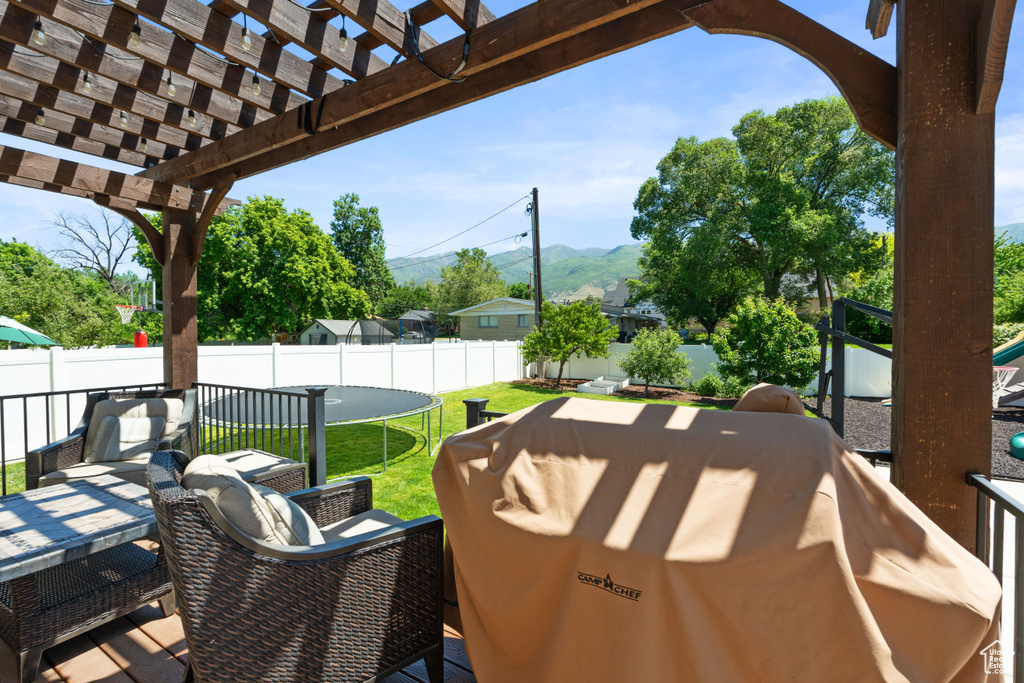 View of patio with a pergola, outdoor dining area, and a mountain view