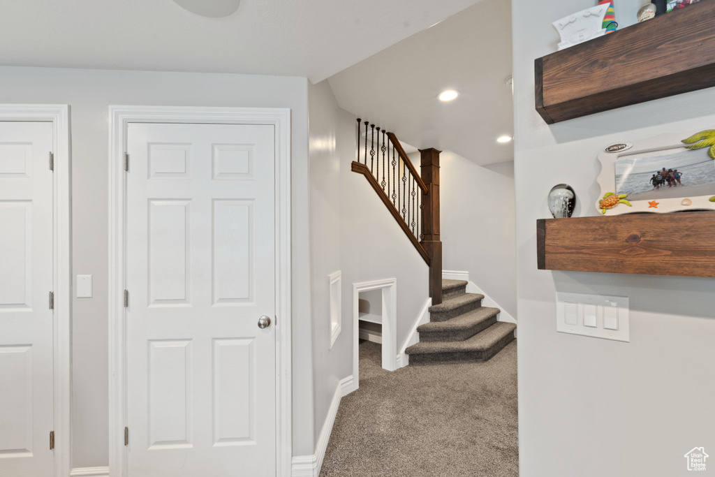 Stairway with carpet flooring, baseboards, and recessed lighting