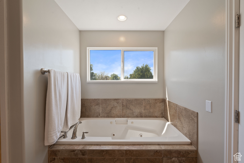 Bathroom featuring a tub with jets