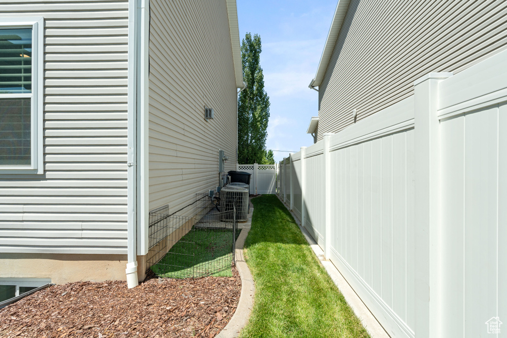 View of yard with central AC