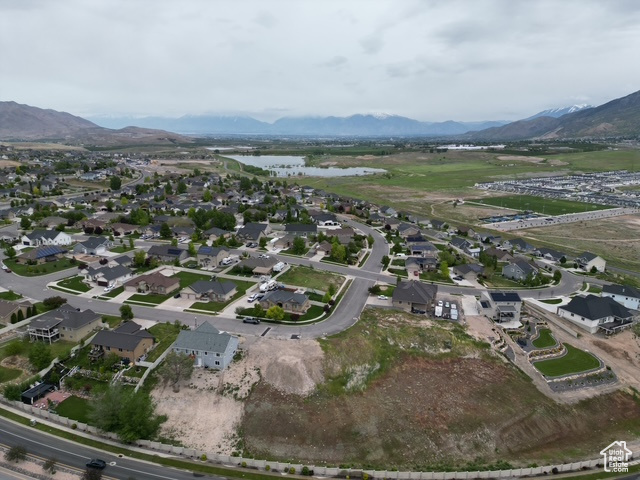 Aerial view of property\\\'s location with a water and mountain view and nearby suburban area