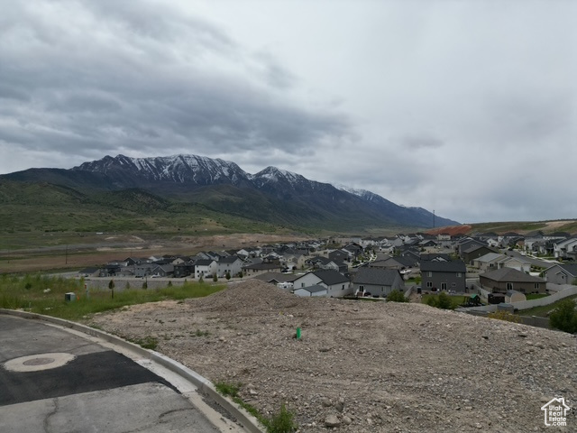 View of mountain background featuring nearby suburban area