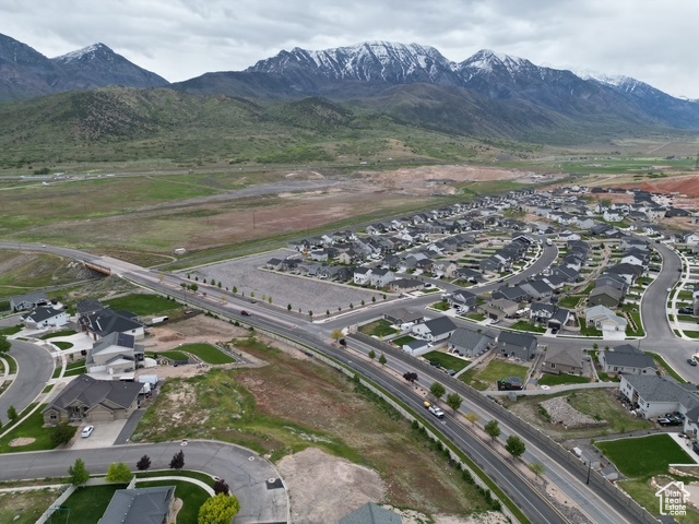 View of property location with mountains and nearby suburban area
