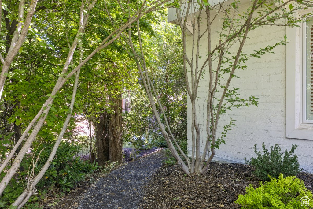 View of side of property featuring concrete block siding
