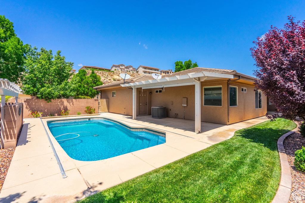 View of pool featuring a patio area, cooling unit, and a pergola